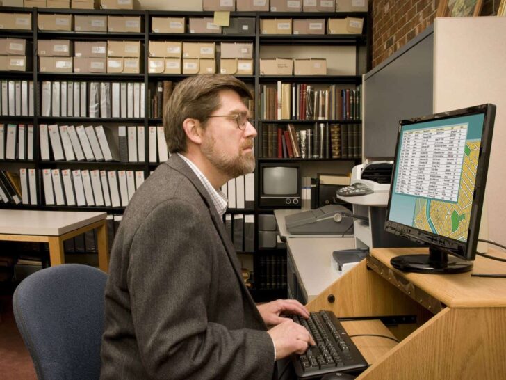 man typing at home based data entry jobs