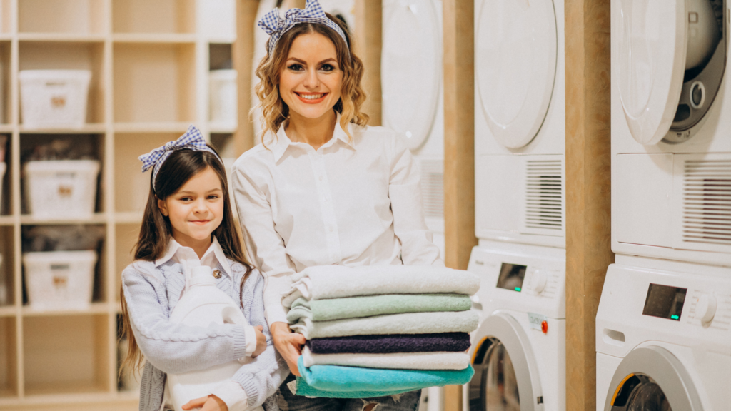 mother and daughter doing laundromat business self service