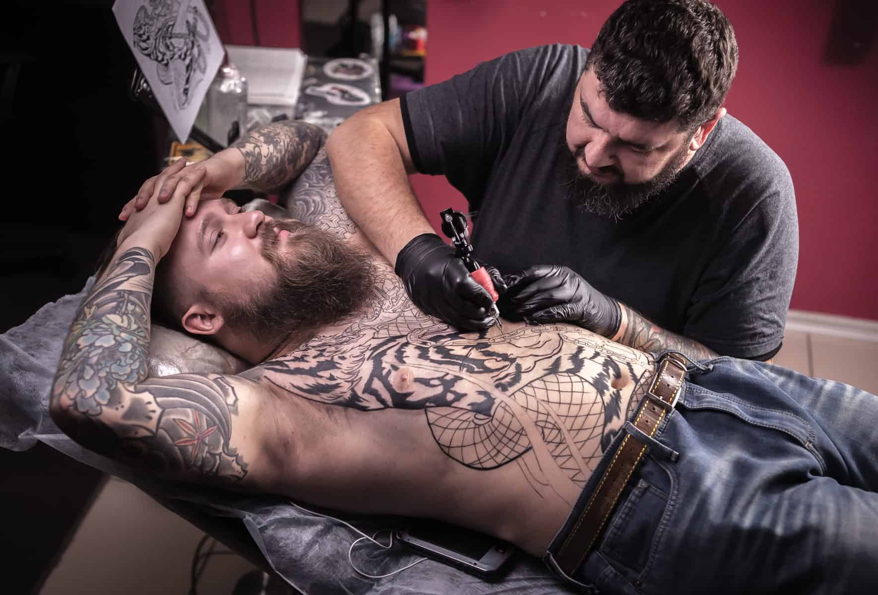 Get paid to draw tattoos with a Professional tattooist posing in studio.