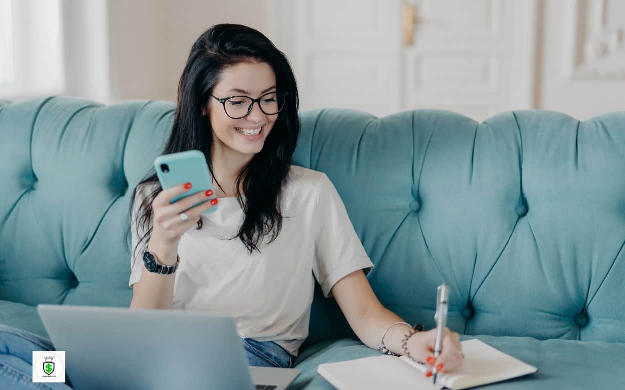 A woman jotting down the list of Top 10 No Interview Remote Jobs